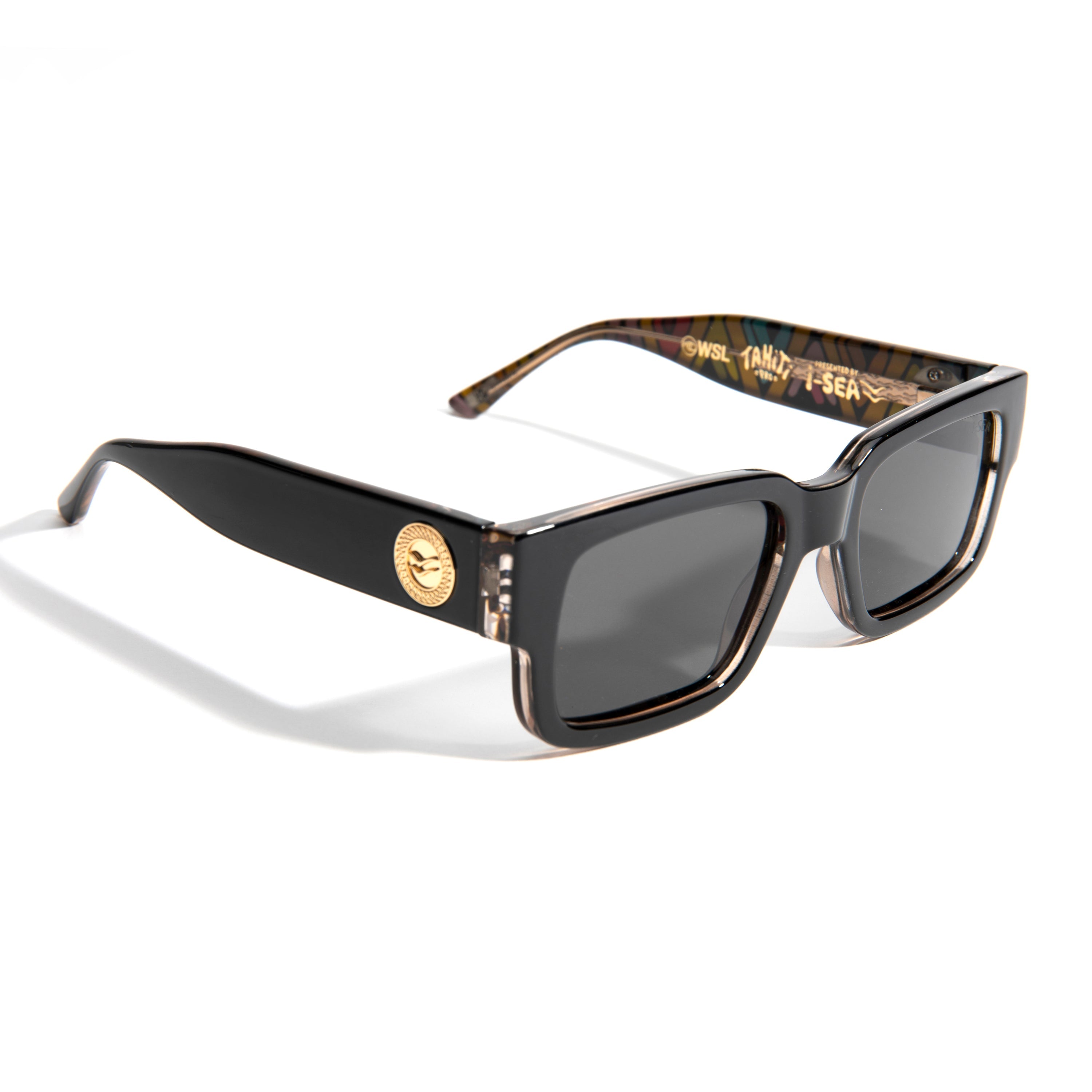 Sunglasses with black frame and gold accents on a white background.
TAHITI PRO / SMOKE POLARIZED LENS