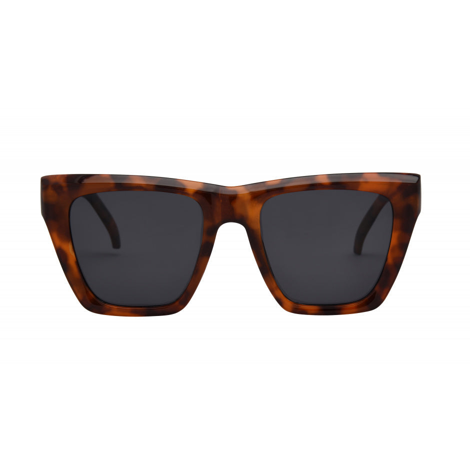 Sunglasses with tortoiseshell frame and dark lenses on a white background.
TORT / SMOKE POLARIZED LENS