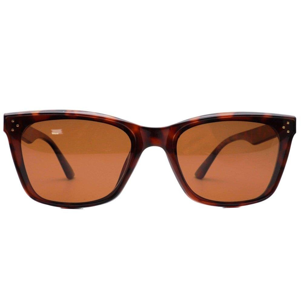 Sunglasses with tortoiseshell frame and brown lenses on a white background.
TORT / BROWN POLARIZED LENS