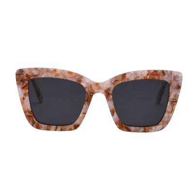 Sunglasses with tortoiseshell frame and dark lenses on a white background.
BUBBLE GUM / SMOKE POLARIZED LENS