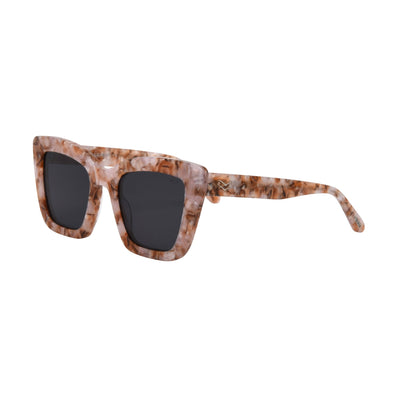 Sunglasses with tortoiseshell frame and dark lenses on a white background.
BUBBLE GUM / SMOKE POLARIZED LENS