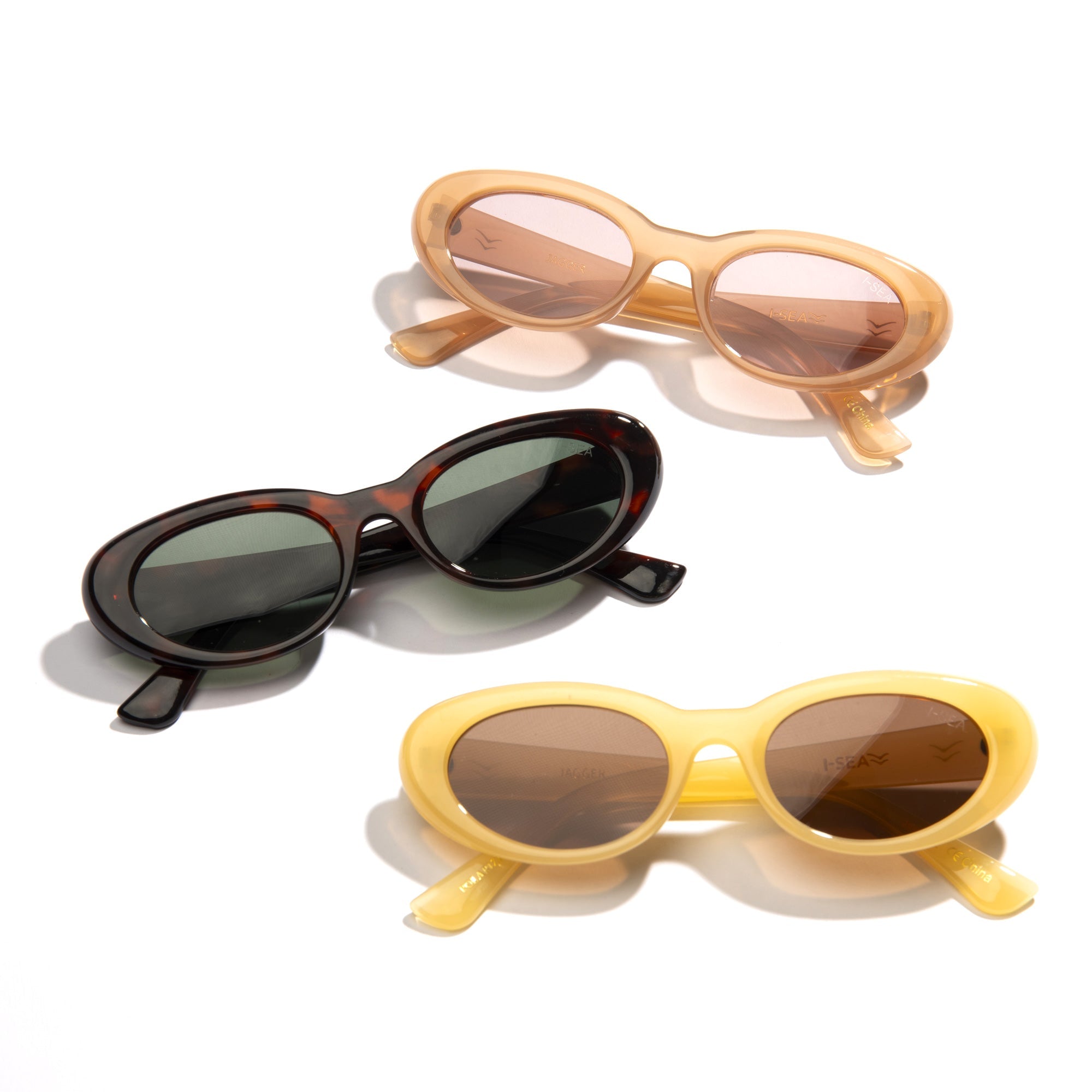 Three pairs of sunglasses in different colors on a white background.
TORT / GREEN POLARIZED LENS