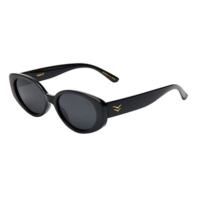 Black sunglasses with gold accents on a white background.
BLACK / SMOKE POLARIZED LENS