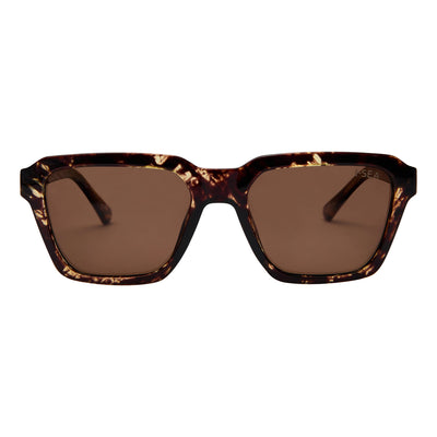 Sunglasses with tortoiseshell frame and brown lenses on a white background.
TORT / PLUM POLARIZED LENS