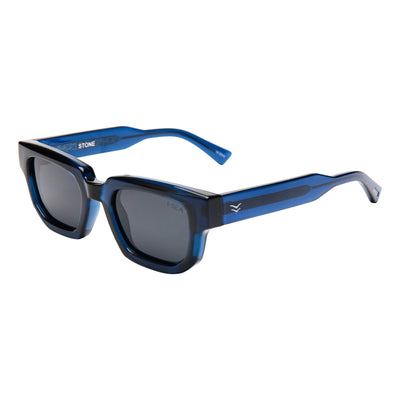 Blue sunglasses with black frames on a white background.
DARK SEAS / SMOKE POLARIZED LENS