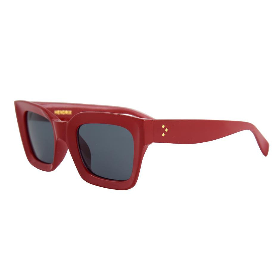 Red sunglasses with dark lenses on a white background.
Red /Smoke Polarized
