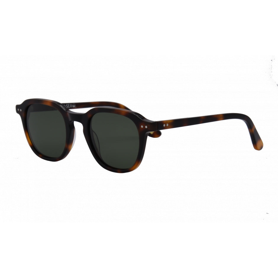 Sunglasses with tortoiseshell frame and dark lenses on a white background.
Tort / Green Polarized Lens