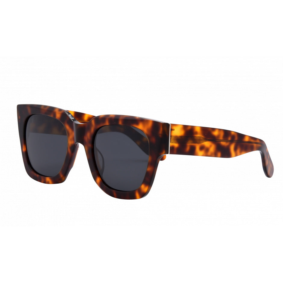 Sunglasses with tortoiseshell frame and dark lenses on a white background.
TORT / SMOKE POLARIZED LENS